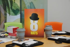 8HATS logo on table